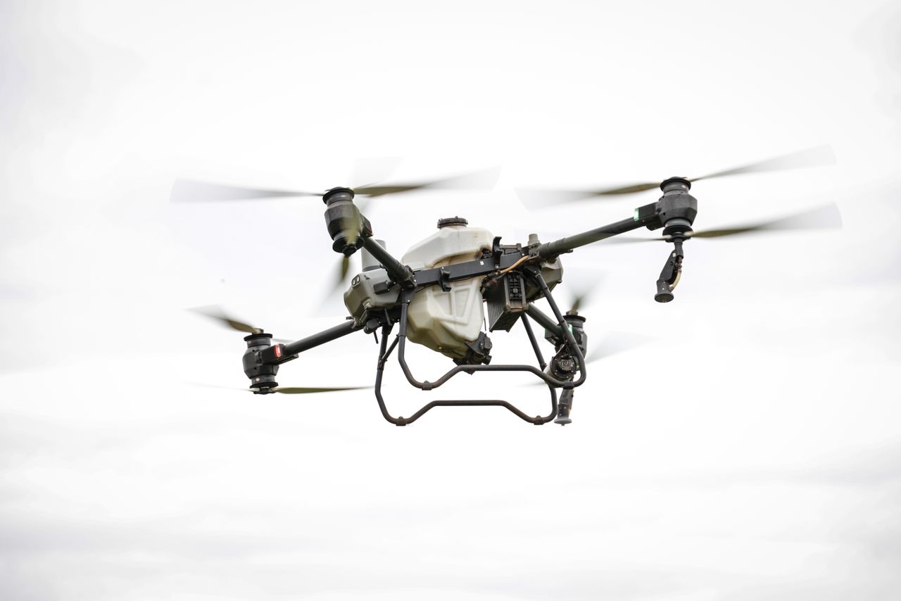 High-tech drone used for agricultural purposes, showcasing modern farming technology.